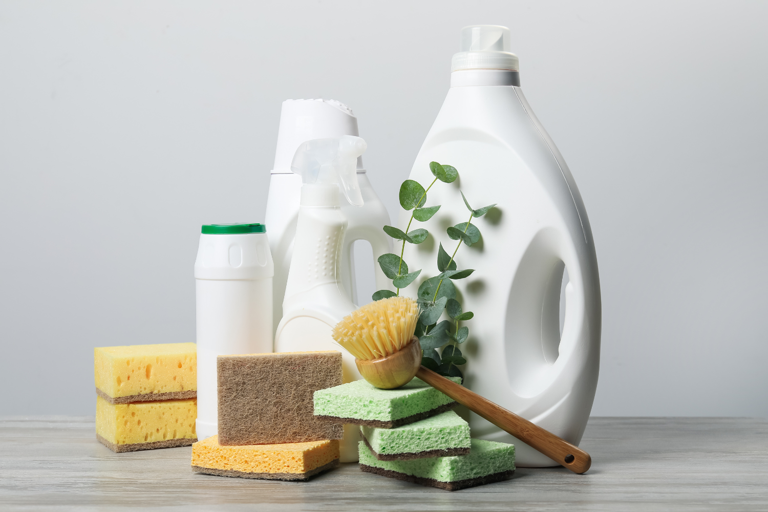 Eco friendly cleaning products on a wooden surface.